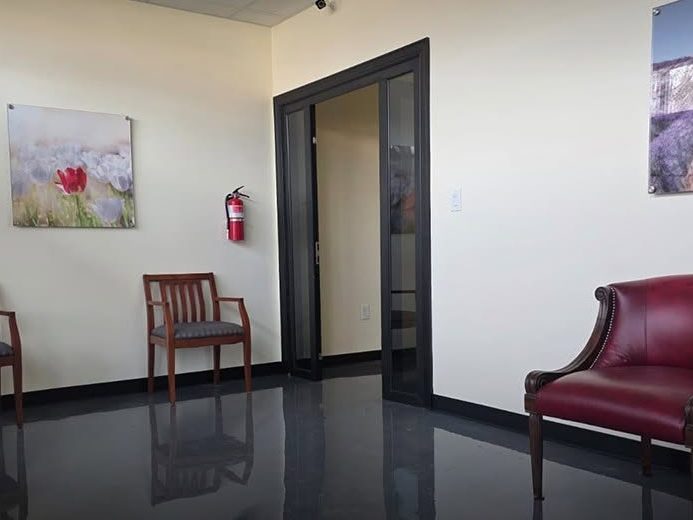 Lobby seating with leather chairs and framed art